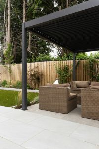 Wonderful Garden Renovation in Dublin. Tiles, artificial grass, and pergola supplied by Tile Merchant Ireland